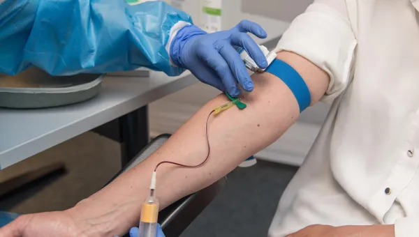 taking blood from a patient's arm