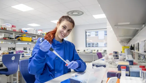 A cancer immunology researcher carries out work in a medical lab