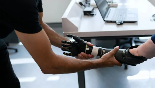 A patient has a prosthetic arm fitted