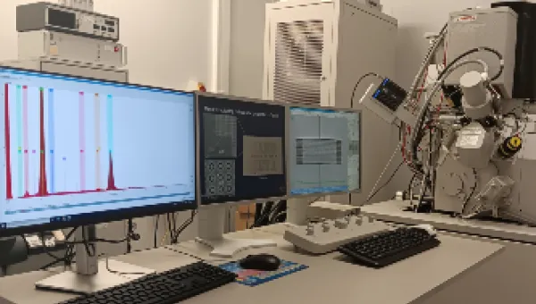 The Focused Ion Beam (FIB) Facility. The image shows three computer screens showing data, with laboratory equipment in the background