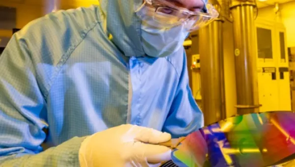 A researcher with 200mm wafer