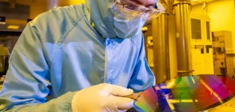 A researcher with 200mm wafer