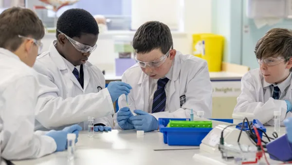 Young students studying chemical reactions