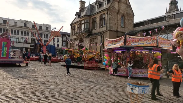 Wide shot of a market in a town centre