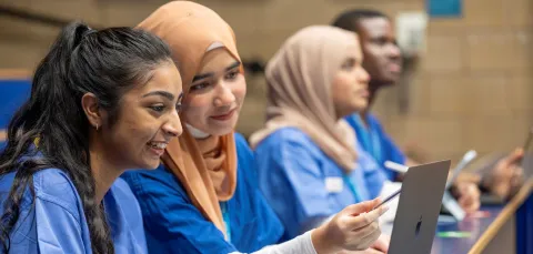 Fahmia and other student doctors sitting at laptops