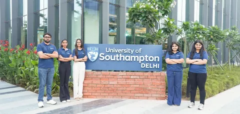 Five students stood outside the entrance to the University of Southampton's Delhi campus.