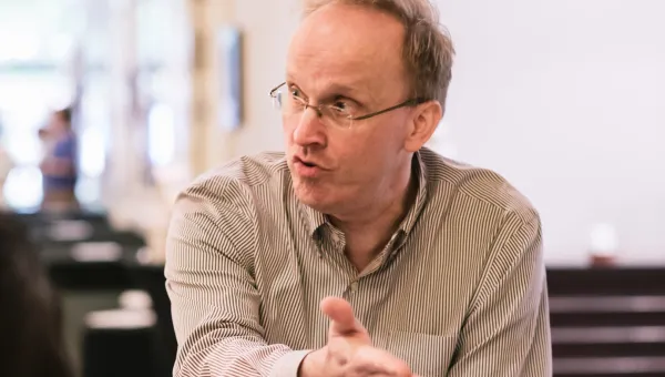Professor Jon Grant talking and gesticulating