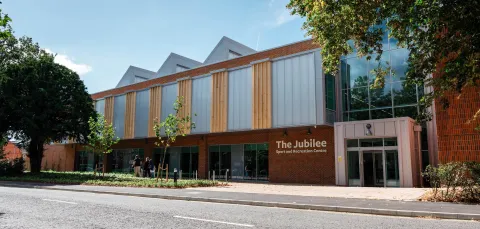 The outside view of the Jubilee Sports Centre on a sunny day.