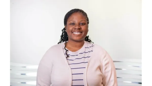 Computer Sciences student researcher smiling at the camera.