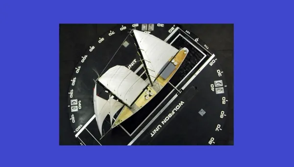 Scale sailing yacht model mounted on a turntable for aerodynamic testing in a wind tunnel