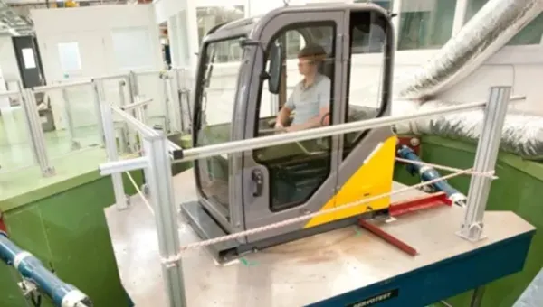 Vehicle cab mounted on a vibration test platform in the VibSim laboratory