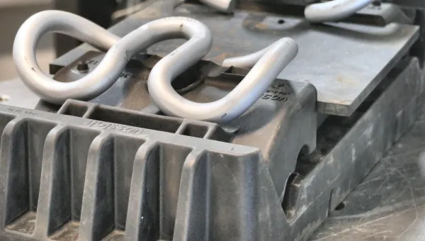 Close-up of a laboratory test specimen mounted in equipment used for vibration and structural testing
