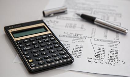 Image showing a calculator and financial paperwork.