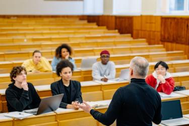 Lecturer and students in a lecture theatre