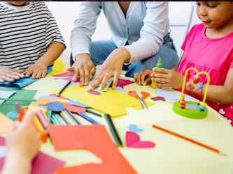 Pexels image of children doing arts and crafts activities with a teacher