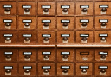 A block of wooden card catalogue drawers