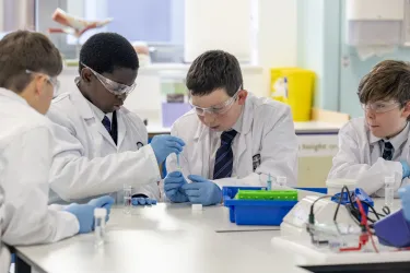 Young students studying chemical reactions