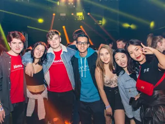 Group of happy fresher students at a nightclub.