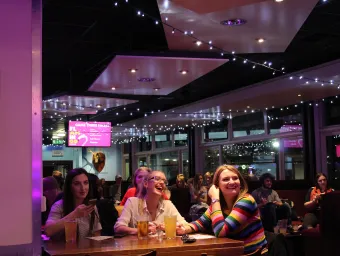 Group of students having fun at a SUSU event in the union bar.