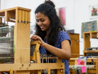 A student using a loom.