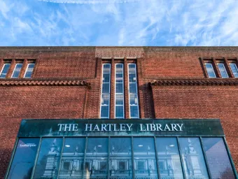 Frontage of the Hartley Library focusing on red brick detail and foyer windows