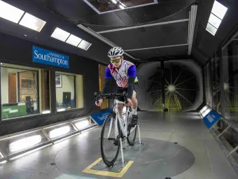Cyclist takes part in an aerodynamics experiment in the R J Mitchell wind tunnel