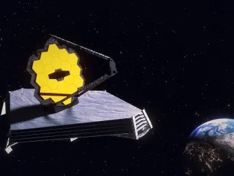 James Web telescope in space with earth on the bottom right.