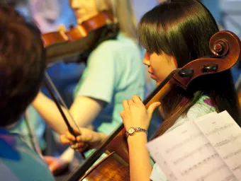 A student playing cello as part of the Southampton University Symphony Orchestra.