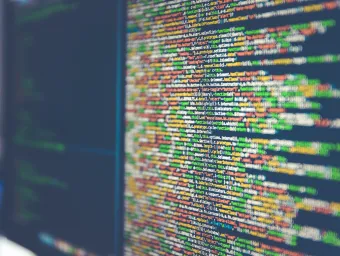 Java coding in different colours on an angled computer screen