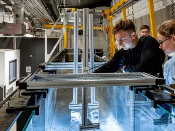 Two students working in a laboratory.