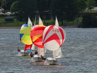 3 sailing boats with spinnakers in a line