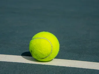 Tennis ball on tennis court