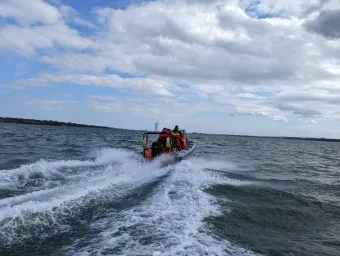 Powerboat speeding away from the camera