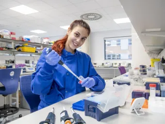 A cancer immunology researcher carries out work in a medical lab