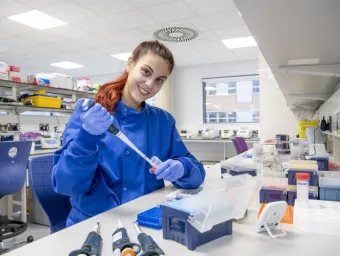 A cancer immunology researcher carries out work in a medical lab