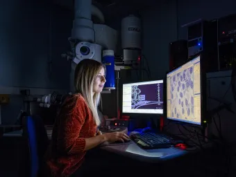 A researcher looking at computer screens 