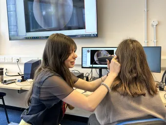 Isabel-McGauley examining patient