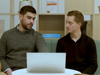 Two members of a knowledge transfer partnership team discuss the project