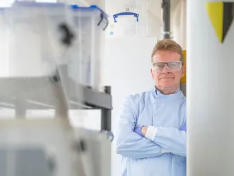NOC consultant Andrew Cundy standing in a lab.