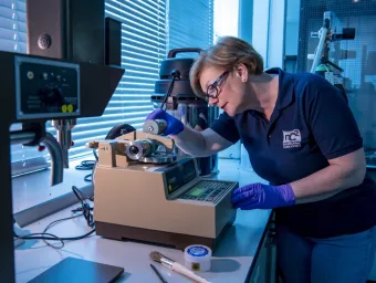 Consultant using a taber abraser at nC2 Consulting