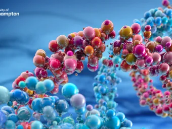 Colourful abstract representation of a molecular structure with glossy spheres in various sizes and colours against a blue background.