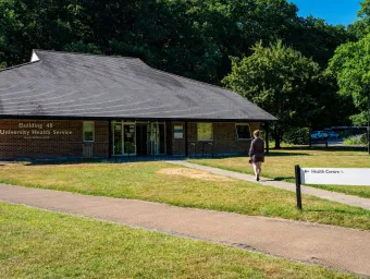 The University of Southampton's health service centre, also known as Building 48. There is a student walking down the path towards the entrance.