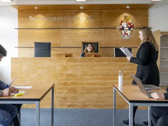 Law students practising in the Moot court room.