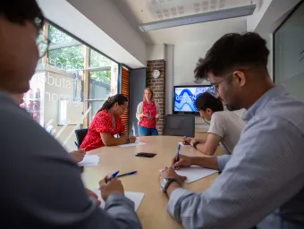 Students taking part in a careers workshop in a university seminar room.