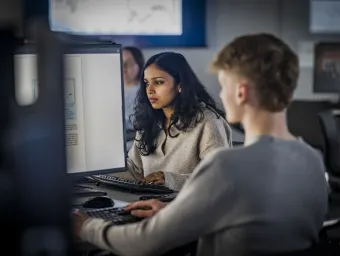 A student sat at a computer screen.