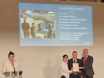 Katherine Kwa and David White receiving the 2026 Hislop Award at the ICE awards ceremony