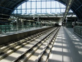 Interior view of a modern railway station, illustrating a railway research and transport environment
