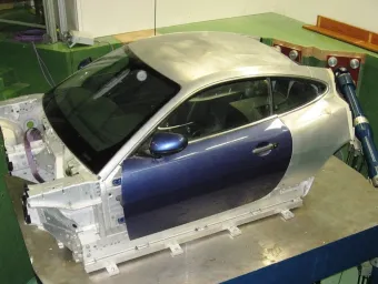 Vehicle body mounted on a six-axis motion simulator in the Vibration and Simulation Laboratory (VibSim)