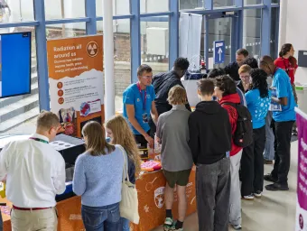 Visitors take part in the “Radiation All Around Us” activity at the Future Chemistry Hub, exploring displays and demonstrations with University of Southampton outreach staff.