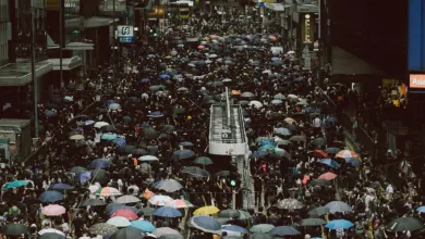 An overhead shot down a wide avenue in Hong Kong, as thousands of protestors take to the streets.